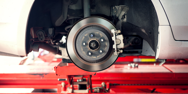 Image Alt Text: Pep Boys technician replacing brakes